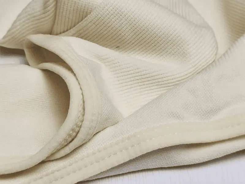 Vista de perto de tecido do Body Modelador Manga Longa Luxe