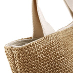 Bolsa de praia de palha com alças reforçadas em algodão e acabamento premium e resistente.