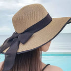 Chapéu de palha feminino com laço preto, aba larga dobrável para praia e proteção UV
