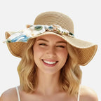 Chapéu de palha feminino com aba larga e laço floral para proteção solar e estilo verão