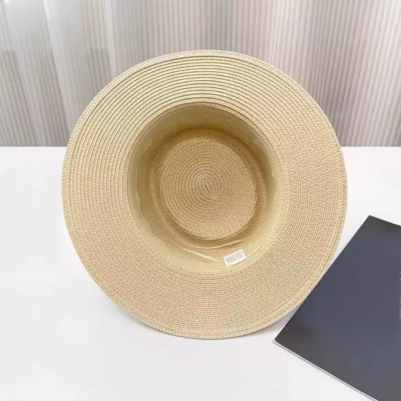 Chapéu de palha bege aba larga vista de cima proteção solar feminino verão