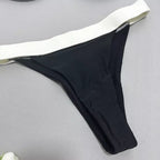 Calcinha de biquíni preta com cós branco, parte inferior fio dental moda praia
