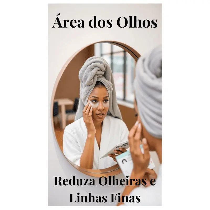 Reflexo no espelho de mulher em roupão aplicando creme para olheiras, promovendo cuidados contra sinais de cansaço.
