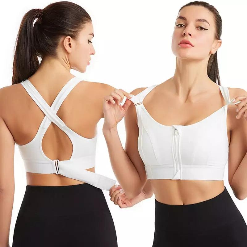 Top esportivo branco com zíper frontal, alças cruzadas nas costas e fivela ajustável, ideal para exercícios.