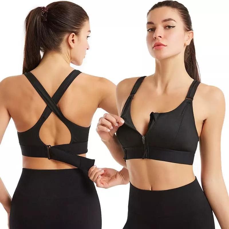 Top esportivo preto com zíper frontal, alças cruzadas nas costas e fivela ajustável, ideal para exercícios.